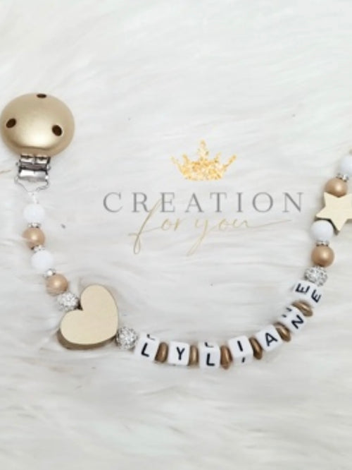 Attache-tétine dorée avec strass personnalisée