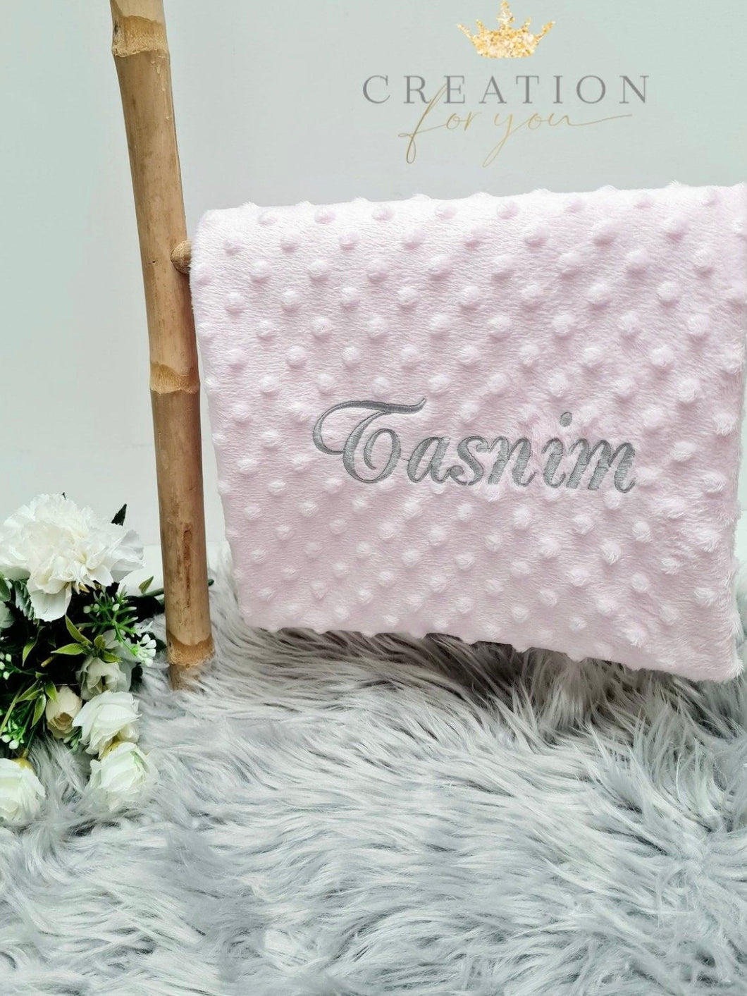 Pink blanket with silver embroidery